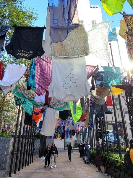 Pia Camil art exhibit with laundry hanging overhead from clotheslines 