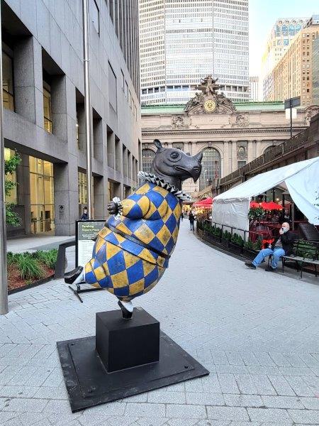 Rhino Harlequin, pirouette by Bjorn Okholm Skaarup outside Grand Central wearing a blue and yellow outfit