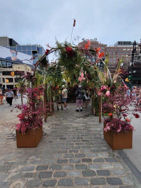 Theresa Rivera exhibit with a floral corridor that visitors can walk through