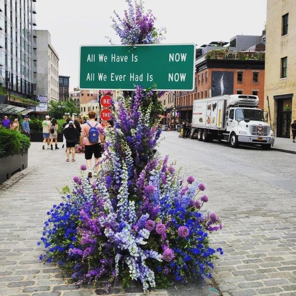 All we have it now, all we ever had is now floral installation with blue and purple flowers by Lewis Miller 