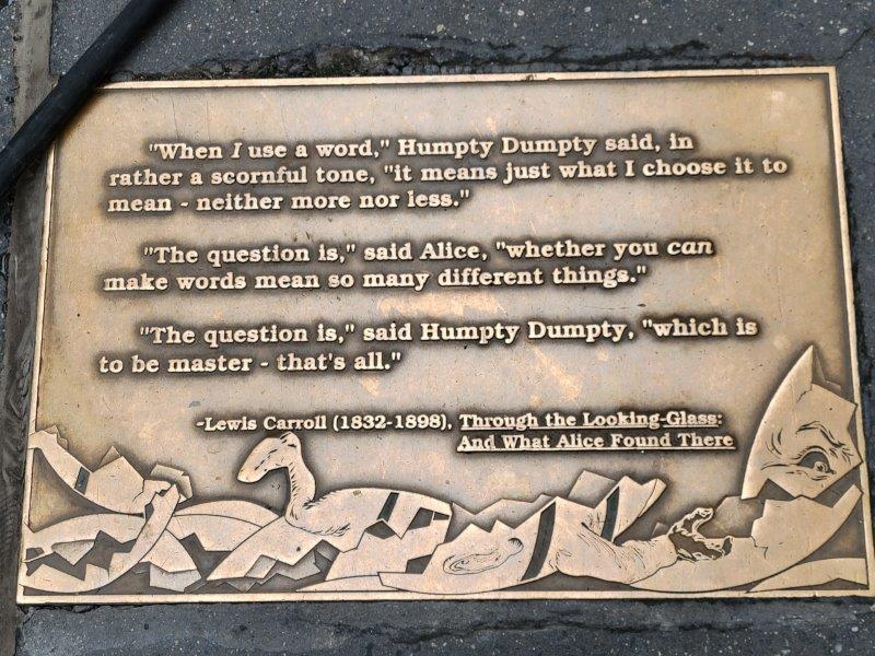 Lewis Carroll sidewalk plaque - quote from Through the Looking Glass: And What Alice Found There