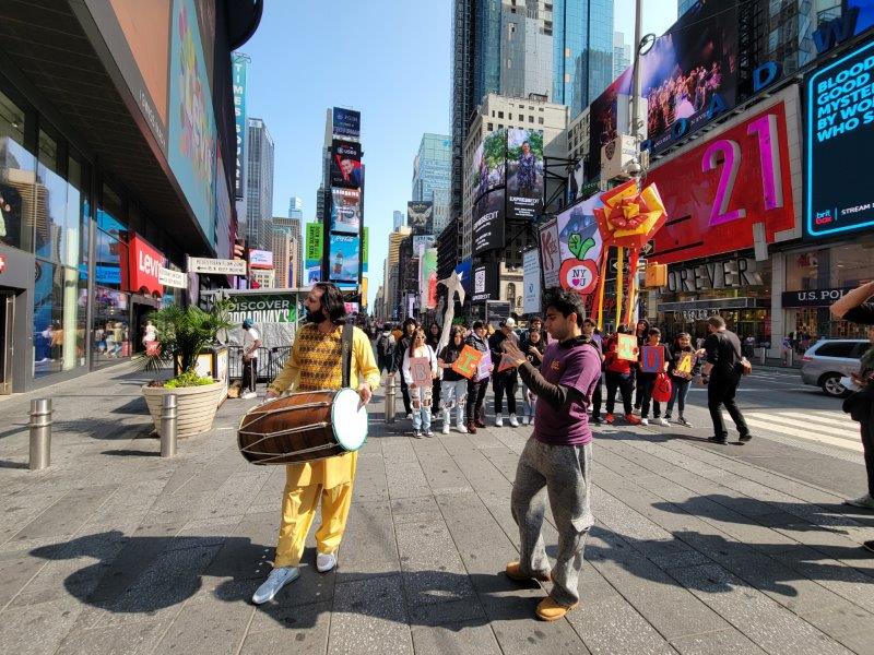 With a backdrop of Times Square