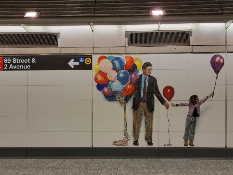 Man and child with balloons