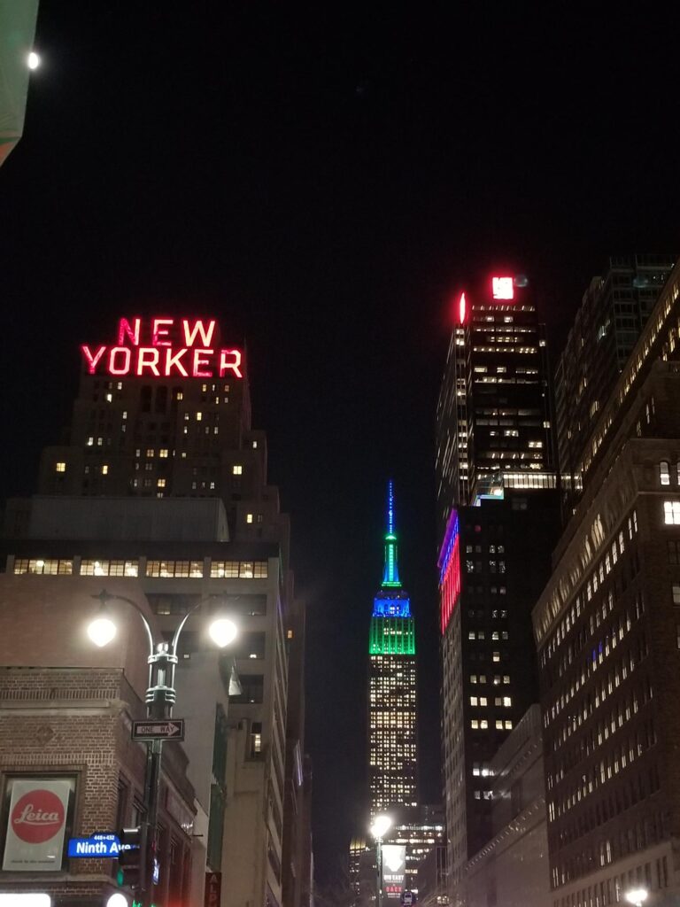 New Yorker Hotel sign with Empire State Building 