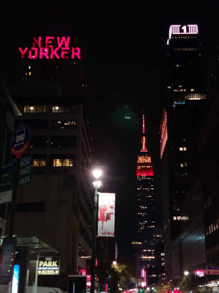 New Yorker Hotel sign with Empire State Building 