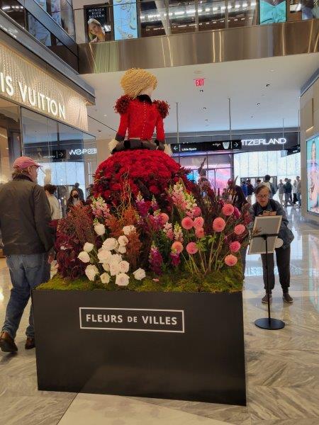 Back of Edith Wharton mannequin in a dress made by florists 