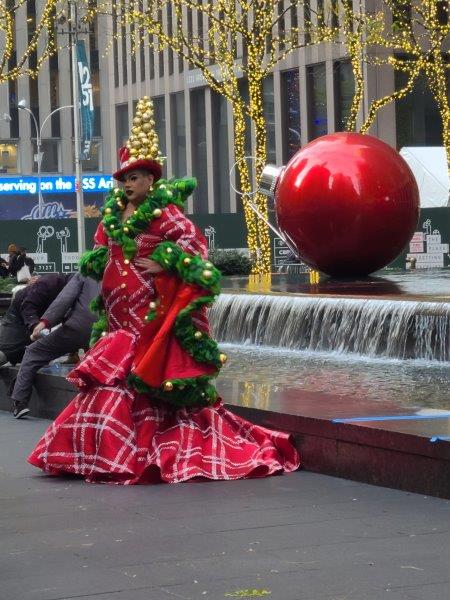 Person dressed as a Christmas Tree on Sixth Ave