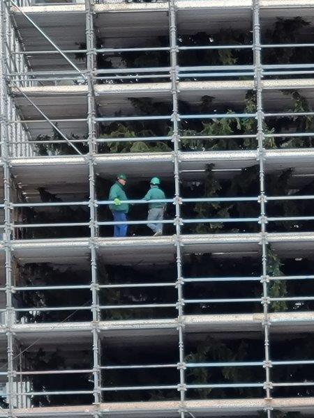 Workers on the scaffolding