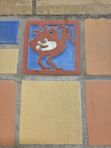 Aztec inspired bird tiles on the walls of the tunnel