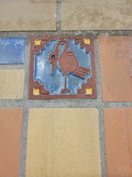 Aztec inspired bird tiles on the walls of the tunnel