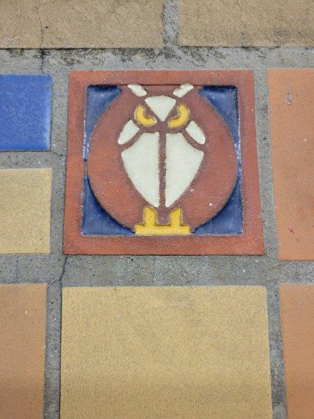 Aztec inspired bird tiles on the walls of the tunnel