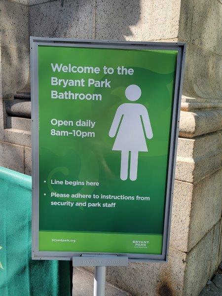 Bryant Park Bathroom welcome sign with hours