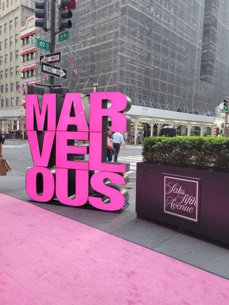 Signs saying Marvelous outside Saks