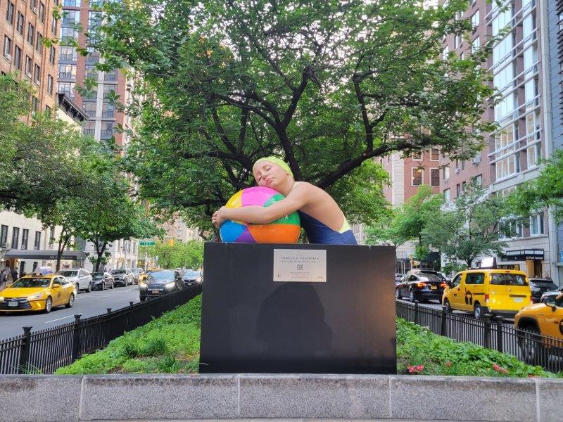 Brooke with the Beach Ball sculpture by Carole A. Feuerman