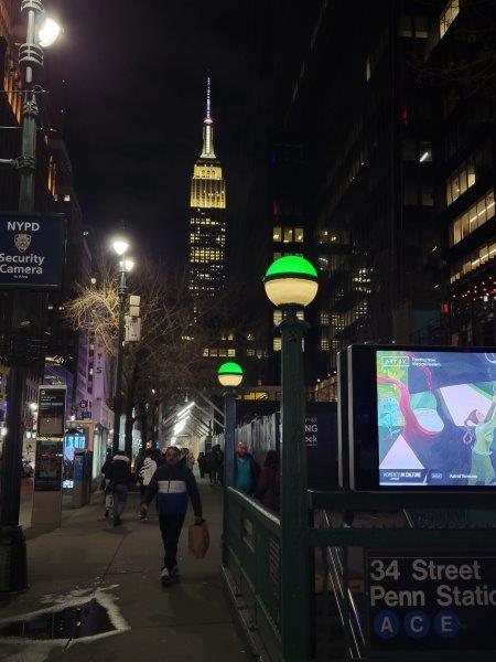 Green light indicating subway station entrance is open