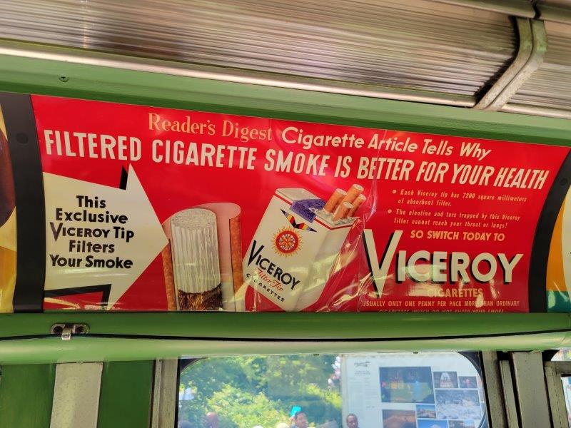 Ad promoting filter cigarettes in Bus 3100 from 1956