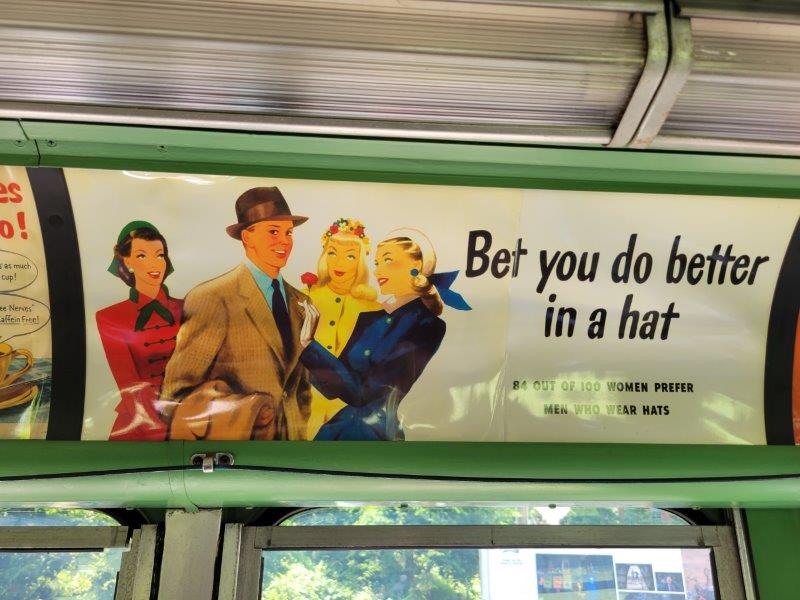 Ad promoting hats for men in Bus 3100 from 1956