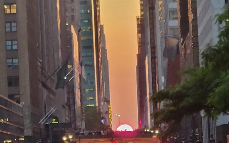 View of setting sun on Manhattanhenge in May 2023