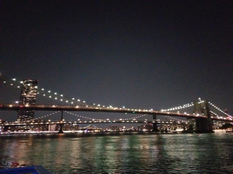 View of Bridges and the East River from South Street Seaport by night