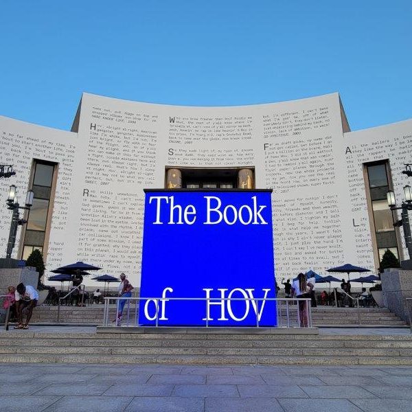 Outer facade of the Brooklyn Public Library like a book with Jay Z lyrics