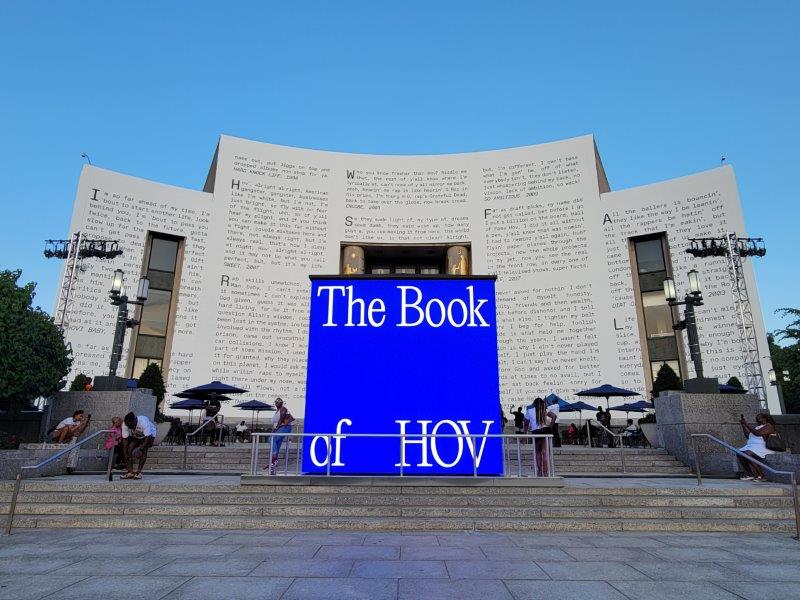 Outer facade of the Brooklyn Public Library like a book with Jay Z lyrics