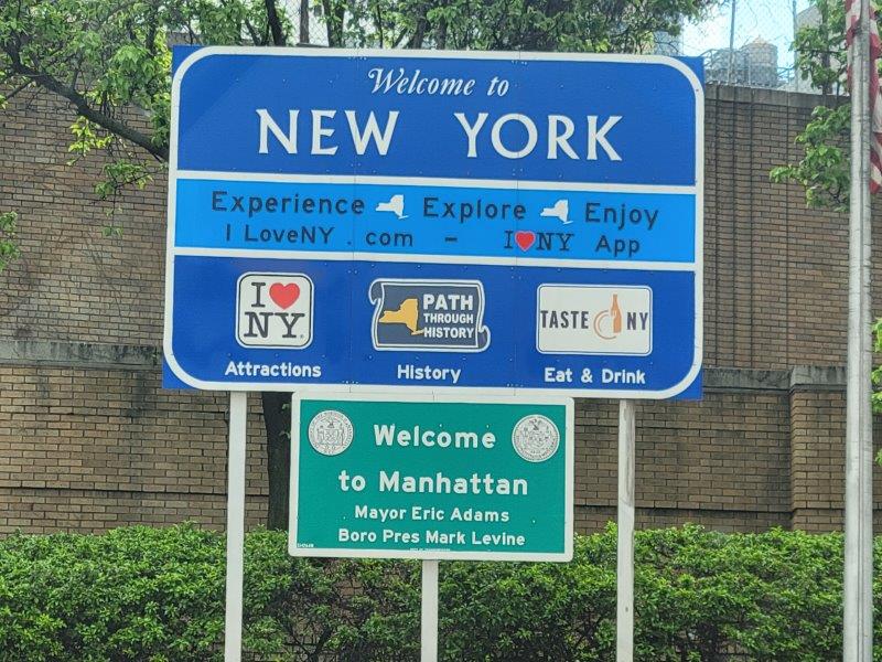 Welcome to New York and Manhattan Sign with names of Eric Adams as Mayor and Mark Levine as Borough President