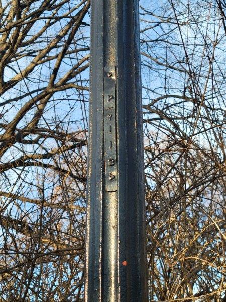 Vertical Location Code on a Central Park Lamp Post - 7113, which means 71st Street on the West Side