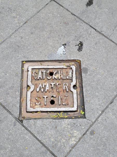 Catskill Water Stent cover on the street on 6th Ave in Manhattan