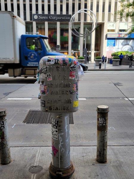 NYC Drinking Water Sampling Stations made of metal and covered with stickers on the streets of New York
