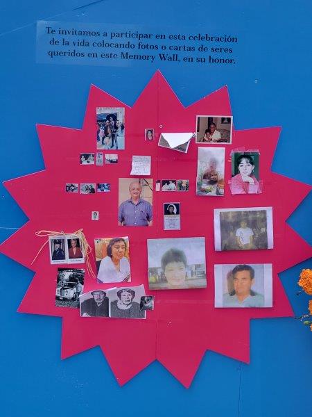 Space to pin photos of loved ones that have been lost on a memory wall at the back of the Rockefeller Center ofrenda