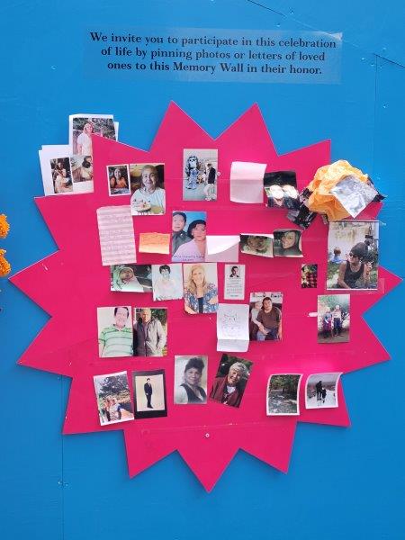 Space to pin photos of loved ones that have been lost on a memory wall at the back of the Rockefeller Center ofrenda