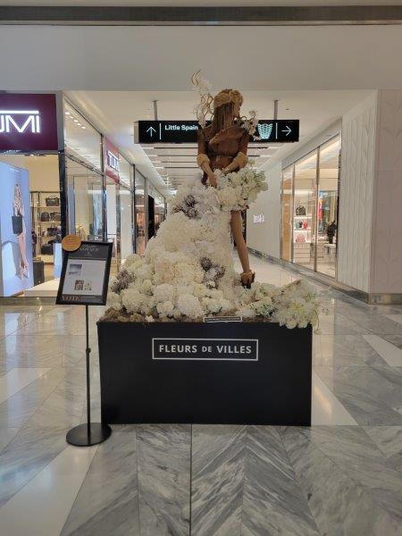 Fleurs de Villes - floral mannequin for Whistler, Canada covered in white flowers to represent snow