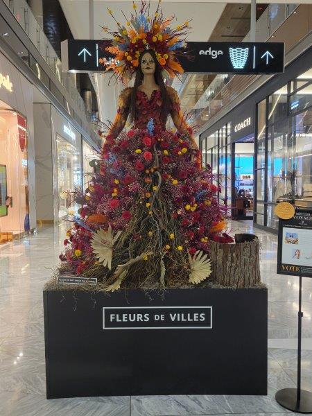 Mannequin for Mexico representing Dia de los Muertos with a floral headpiece