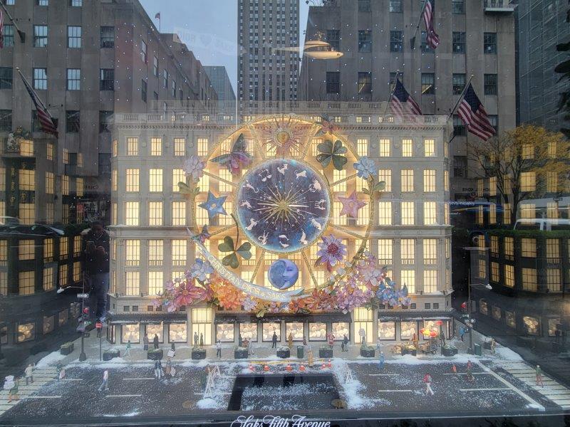 Saks holiday window with a representation of Dior's Carousel of Dreams on it