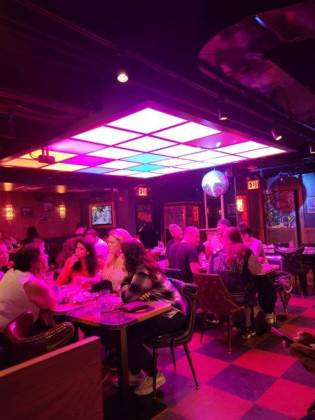 Inside the bar with neon ceiling lights