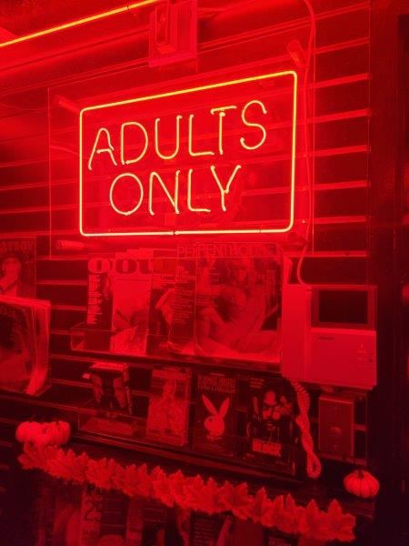 Adults Only sign behind the hostess stand