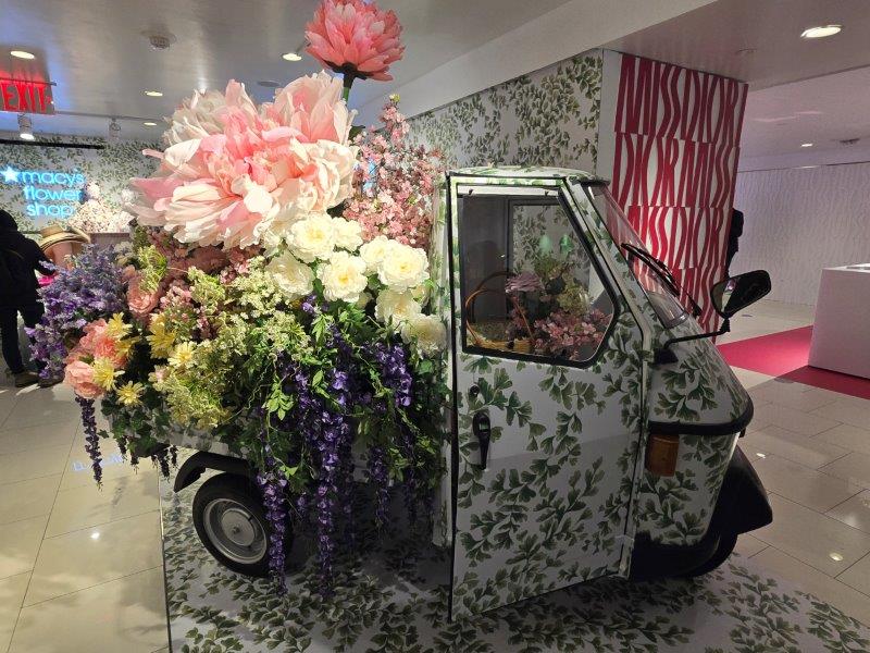 Small van filled with flowers all around