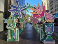 Walkway with real and artistic flowers