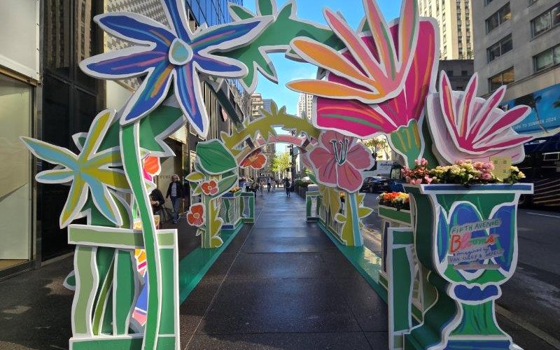 Walkway with real and artistic flowers