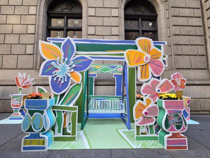 Fifth Avenue Blooms installation in blues featuring a swing