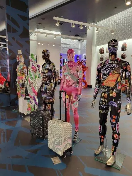 Painted mannequins with Sprayground luggage